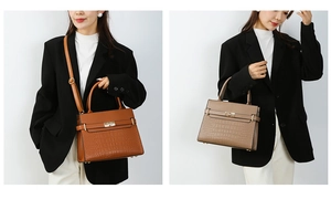 Detail of elegant crocodile pattern leather handbags with gold-tone metal twist lock