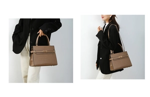 Detail of brown crocodile pattern handbag with reinforced handle and metal clasp closure