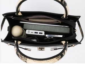 Top view of spacious black tote bag showing multiple interior compartments and large capacity