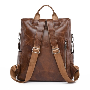 Vintage dark brown PU leather backpack with leaf vein stitching and adjustable straps
