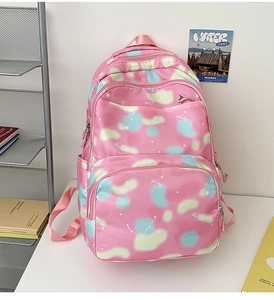 Detail of pink nylon school backpack with pastel floral patterns and heart prints