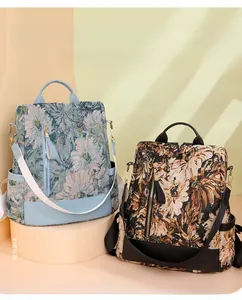 Detailed view of two printed anti-theft nylon backpacks with floral jacquard patterns
