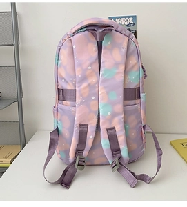Detail of adjustable padded shoulder straps on the starry sky nylon backpack for students