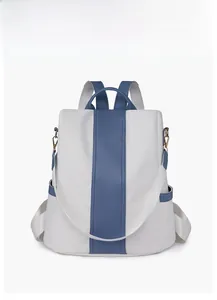 Front view of white and blue color-block backpack with large capacity and silver zippers