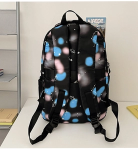 Detail of starry nylon backpack with thickened straps and side mesh storage pocket