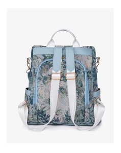 Detail of floral nylon backpack featuring retro jacquard fabric and rose gold hardware