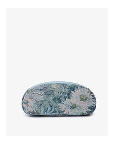 Close-up of floral jacquard nylon fabric with light blue daisy patterns and leather trim