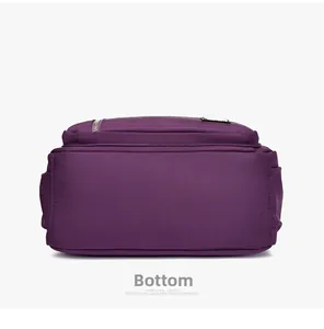 Flat bottom view of the purple nylon shoulder bag showing durable stitching and zippers