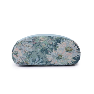 Floral jacquard nylon backpack with vintage tapestry pattern and blue trim details