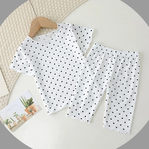 Polka dot baby summer pajama set with ruffled short sleeves and matching long pants