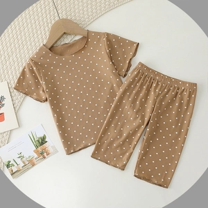 Toddler summer pajamas set with polka dot pattern and ribbed fabric in caramel brown