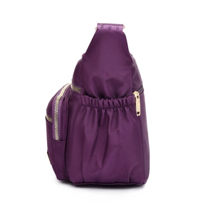 Purple nylon crossbody bag with multiple pockets and side drawstring storage compartment