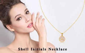 Close-up of 18K gold plated necklace featuring a round pink shell pendant with initial A