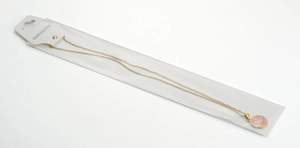 Detail of 18K gold stainless steel necklace with pink shell K-letter round pendant