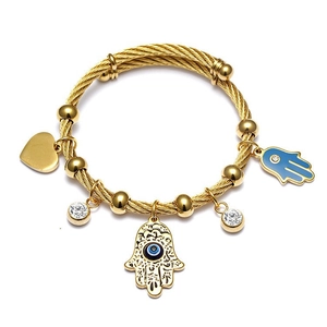 18K gold braided cable bracelet with Hamsa Hand and Evil Eye charms and heart pendant