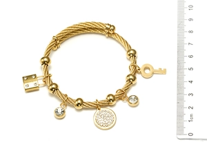 Detailed view of 18K gold plated steel cable bracelet with pavé charms and size scale