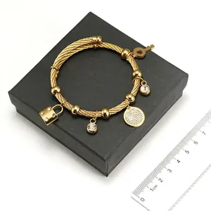 18K gold plated stainless steel cable bracelet with lock, key and crystal charms