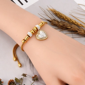Bracciale con ciondolo a cuore in oro 18 carats e catena a serpente in cristallo
