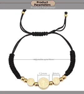 Detail view of adjustable black braided bracelet with 12mm and 8mm religious gold medals