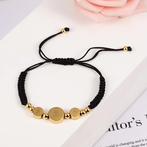Adjustable black woven rope bracelet with 18K gold stainless steel Saint Benedict charms