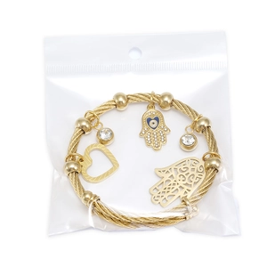 Bracciale a maglia dorata con ciondoli Mano di Fatima e cuore in bustina protettiva