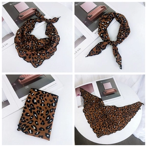 Detailed close-up of leopard print silk scarf showing multiple elegant styling and knotting methods