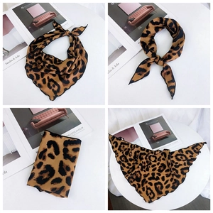 Detail of leopard print silk scarf showing wavy edges and smooth fabric texture