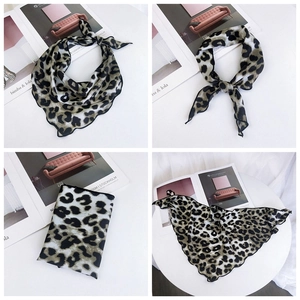 Detailed views of leopard print silk scarf showing textures and styling as a necktie