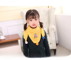 Detail of yellow cotton triangle scarf with bunny print and 3D plush bear for kids