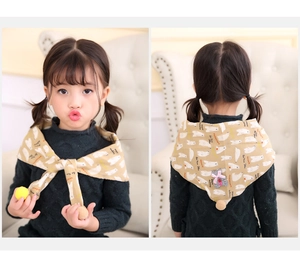 Close-up of beige cotton kids neck scarf with polar bear prints and plush pom pom trim