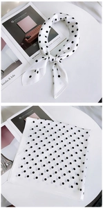 Detail view showing black polka dot silk scarf in knotted and flat square styles