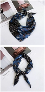 Detailed view of the knotted leopard and geometric print silk scarf in navy and brown
