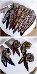 Detail of pleated skinny scarves featuring four distinct leopard print color patterns
