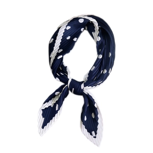 Navy blue pleated neck scarf with white polka dots and elegant wavy line patterns