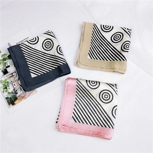 Three elegant silk scarves with geometric patterns and striped borders in various colors