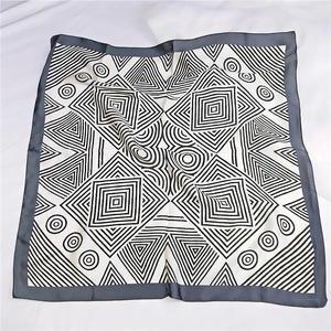70cm square silk scarf with black and white geometric pattern on white cloth