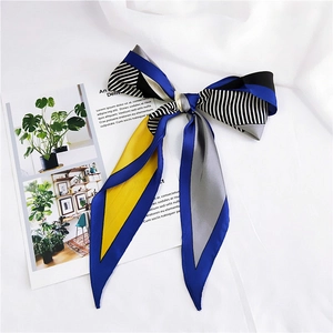 Fashionable color-block geometric silk scarf with satin finish on white fabric