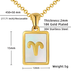 Macro detail of Aries zodiac pendant with white shell inlay and 18K gold plated steel