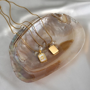 18K gold plated stainless steel Aquarius necklace with rectangular white shell pendant