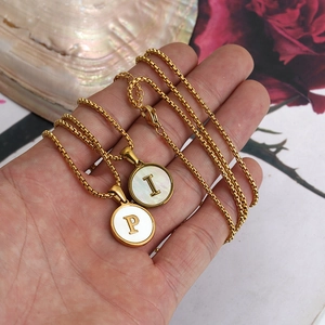 18K gold plated stainless steel initial necklace with white shell pendant on box chain