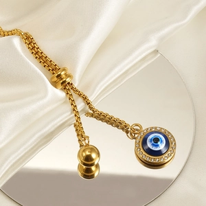 Bracelet œil porte-bonheur plaqué or 18 carats avec cristaux et cordon coulissant réglable