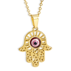 Macro-opname van gouden Hamsa Hand-hanger met boze oog en hol uitgesneden patroon