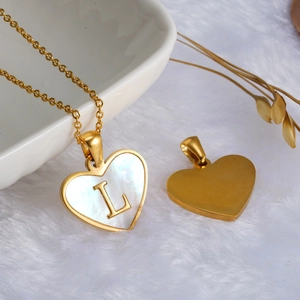 Golden heart necklace with white mother of pearl inlay and capital letter L pendant