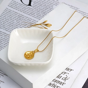 Golden 18K stainless steel Scorpio zodiac coin necklace with a sleek snake chain