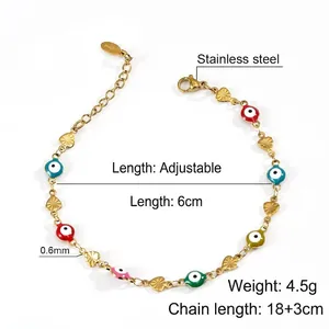 Detail of multi-colored evil eye beads and gold heart charms on a stainless steel chain