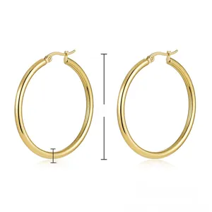Macro shot of 40mm golden stainless steel hoop earrings with 2mm thickness dimensions