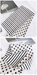 Détail d'un foulard en soie montrant le contraste entre rayures et motifs à pois