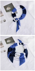 Détail d'un foulard en soie rayé bleu et blanc montrant deux styles de nouage