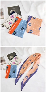 Detailed close-up of sunflower and polka dot silk scarves in three elegant colorways
