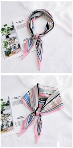 Detail of silk-like neckerchief with pink and blue geometric lines as a bag handle decor